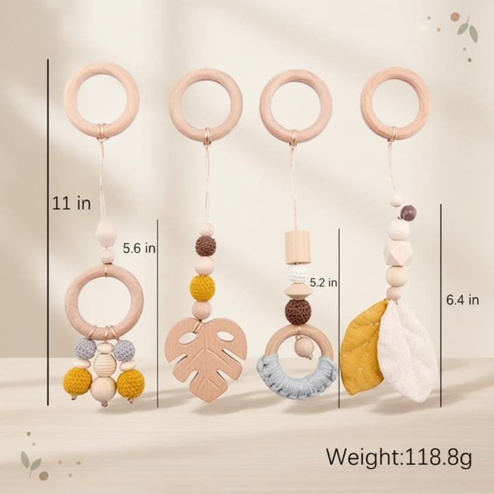 Four Yellow Leaf hanging toys with wooden rings, beads, leaf shapes, and length measurements.