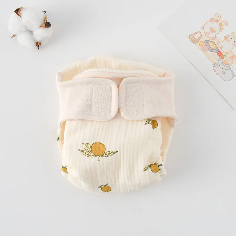 Cloth diaper with yellow lemons and green leaves
