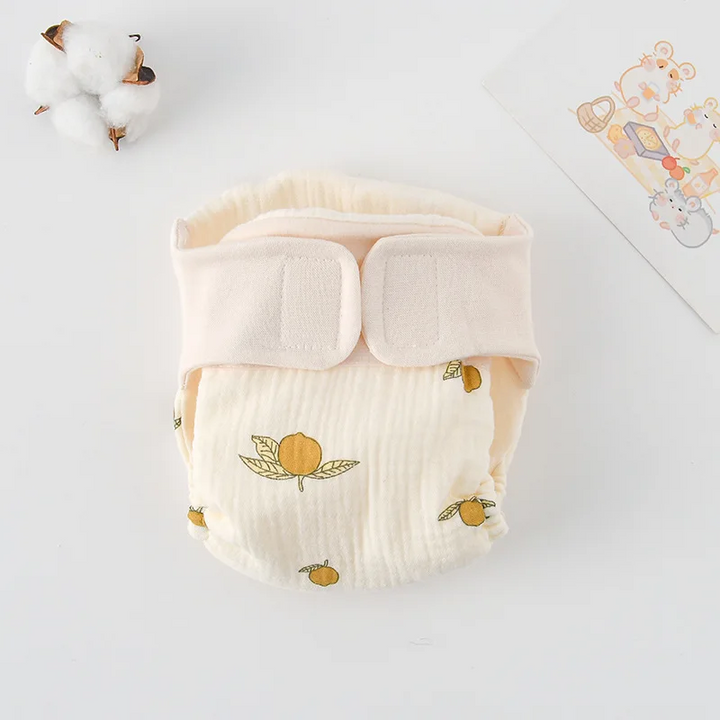 Cloth diaper with yellow lemons and green leaves
