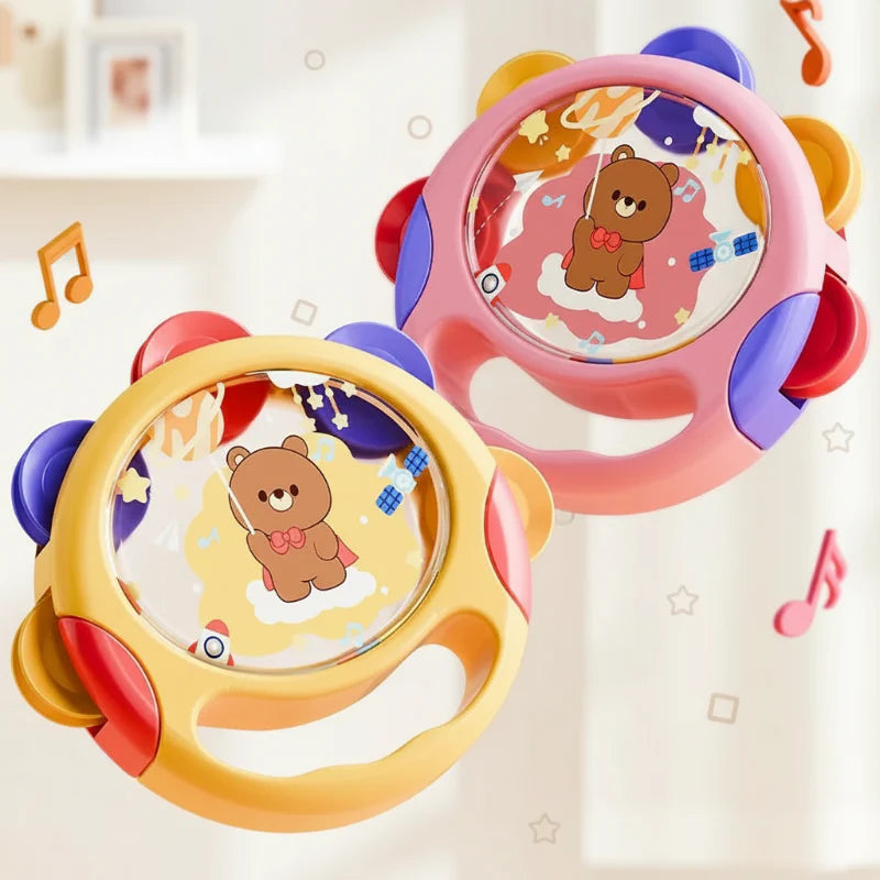 Yellow and pink toy tambourines with bear-and-space drum faces and built-in handles