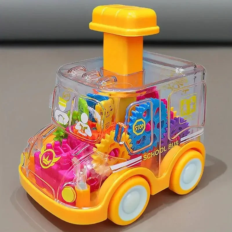 Yellow school bus toy with a clear body, colorful internal gears, and a yellow top button