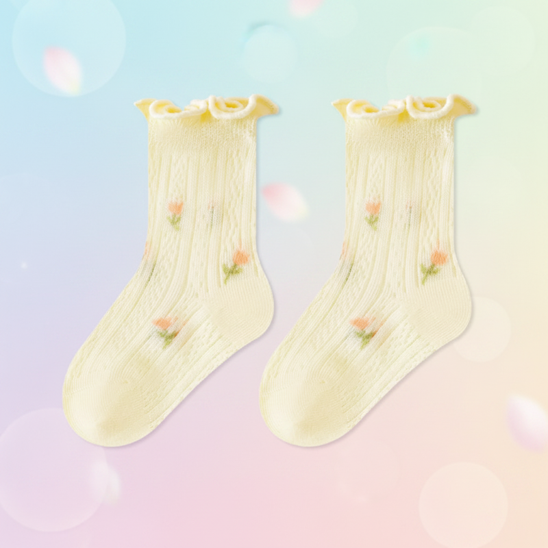 Pair of yellow baby socks with small floral accents and ruffled cuffs.