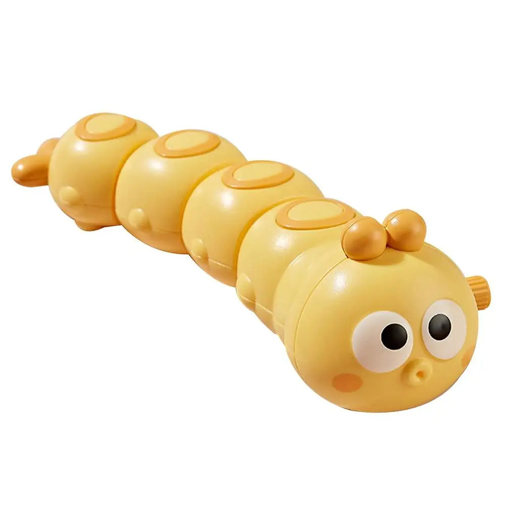 Yellow wind-up caterpillar toy with orange accents and a segmented body