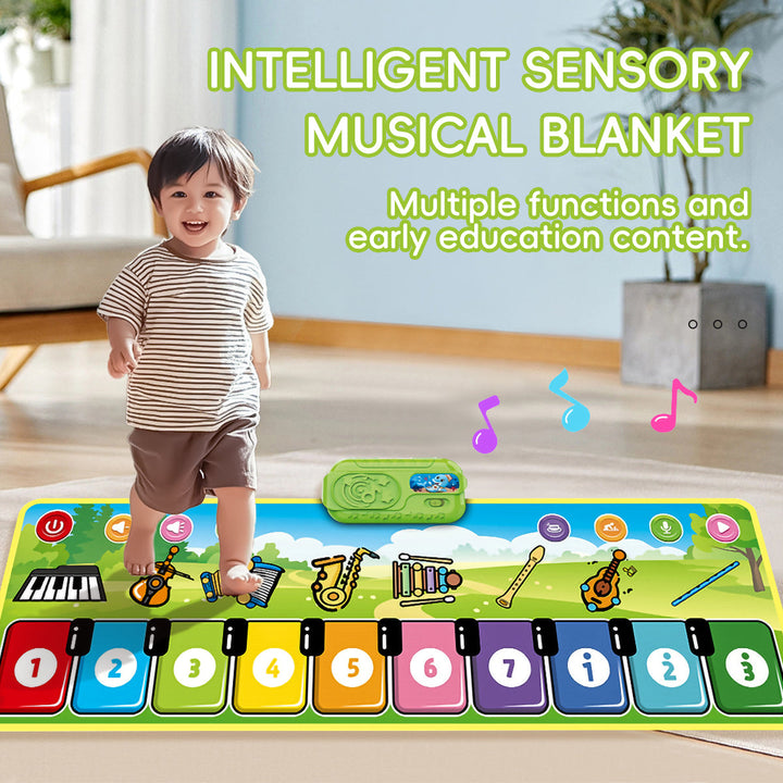 Young child standing on colorful musical keys beside the mat&