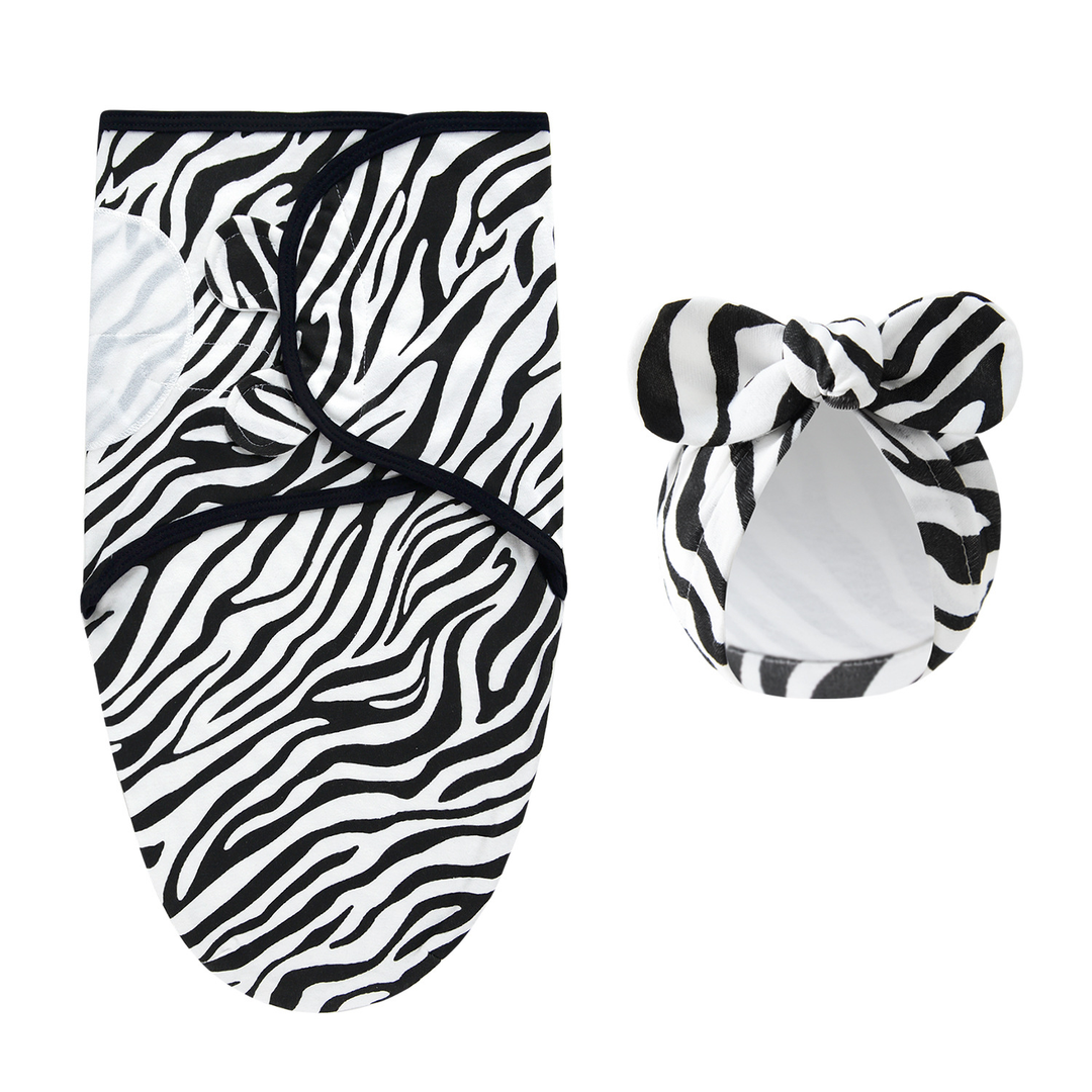 Black-and-white zebra-striped swaddle blanket and matching bow hat
